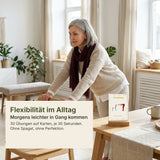 Frau ab 60 dehnt den Rücken mit Halt an einer Stuhllehne, daneben die Karte Flexibilität der Silver Moments Cards